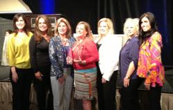 Pam Wade and the Gables Corporate Accommodations Team accepting Tower of Excellence Award for Company of the Year and Pam Wade as Individual of the Year
